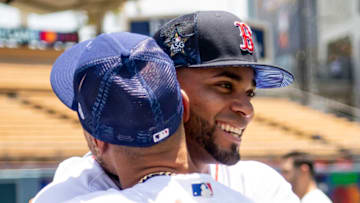 LOS ANGELES, CALIFORNIA - JULY 18: Xander Bogaerts #2 of the Boston Red Sox reacts with Mookie Betts #50 of the Los Angeles Dodgers during the 2022 Gatorade All-Star Workout Day at Dodger Stadium on July 18, 2022 in Los Angeles, California. (Photo by Billie Weiss/Boston Red Sox/Getty Images)