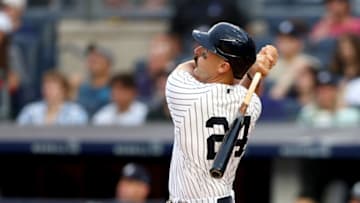 NEW YORK, NEW YORK - JULY 16: Matt Carpenter #24 of the New York Yankees hits a three run home run in the first inning against the Boston Red Sox at Yankee Stadium on July 16, 2022 in the Bronx borough of New York City. (Photo by Elsa/Getty Images)