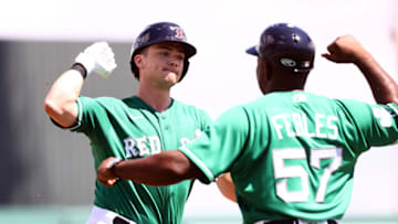Mar 17, 2022; Fort Myers, Florida, USA; Boston Red Sox first baseman Bobby Dalbec (29) is congratulated as he runs around the bases as he hits a 2-run home run during the first inning against the Minnesota Twins at JetBlue Park at Fenway South. Mandatory Credit: Kim Klement-USA TODAY Sports