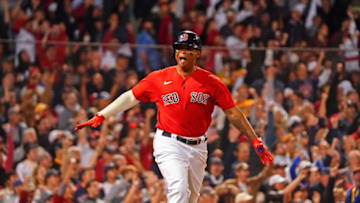 Oct 11, 2021; Boston, Massachusetts, USA; Boston Red Sox third baseman Rafael Devers (11) reacts after hitting a three-run home run against the Tampa Bay Rays during the third inning during the third inning during game four of the 2021 ALDS at Fenway Park. Mandatory Credit: David Butler II-USA TODAY Sports
