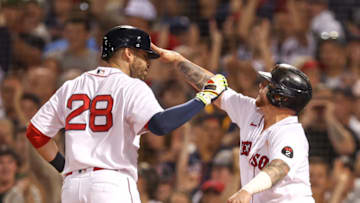 Jul 10, 2022; Boston, Massachusetts, USA; Boston Red Sox designated hitter JD Martinez (28) is congratulated by catcher Christian Vazquez (7) after hitting a home run during the fifth inning against the New York Yankees at Fenway Park. Mandatory Credit: Paul Rutherford-USA TODAY Sports