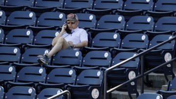 Feb 24, 2021; Tampa, Florida, USA; New York Yankees general manager Brian Cashman looks on during spring training workouts at George M. Steinbrenner Field. Mandatory Credit: Kim Klement-USA TODAY Sports