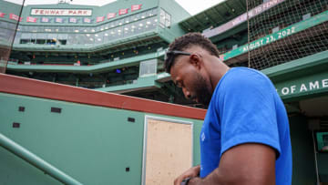 Aug 23, 2022; Boston, Massachusetts, USA; Toronto Blue Jays right fielder Jackie Bradley Jr. (25) signs autographs before the start of the game against the Boston Red Sox at Fenway Park. Mandatory Credit: David Butler II-USA TODAY Sports