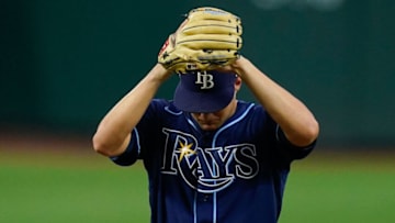 Jul 26, 2022; Baltimore, Maryland, USA; Tampa Bay Rays starting pitcher Shane McClanahan (18) prepares to throws a first inning pitch against the Baltimore Orioles at Oriole Park at Camden Yards. Mandatory Credit: Tommy Gilligan-USA TODAY Sports