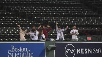 Sep 26, 2022; Boston, Massachusetts, USA; Fans dance in the stands during a rain delay in the game between the Boston Red Sox and Baltimore Orioles at Fenway Park. Mandatory Credit: Bob DeChiara-USA TODAY Sports