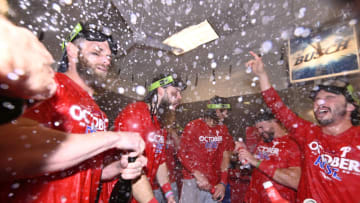 Oct 8, 2022; St. Louis, Missouri, USA; Members of the Philadelphia Phillies celebrate in the clubhouse following their 2-0 victory against the St. Louis Cardinals during game two of the Wild Card series for the 2022 MLB Playoffs at Busch Stadium. Mandatory Credit: Jeff Curry-USA TODAY Sports