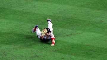 Oct 17, 2018; Houston, TX, USA; Boston Red Sox left fielder Andrew Benintendi (16) makes a game ending diving catch during the ninth inning against the Houston Astros in game four of the 2018 ALCS playoff baseball series at Minute Maid Park. Mandatory Credit: John Glaser-USA TODAY Sports