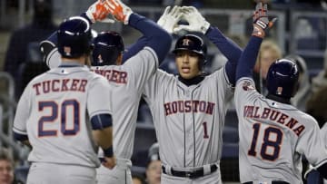 Apr 6, 2016; Bronx, NY, USA; Houston Astros shortstop Carlos Correa (1) congratulates right fielder George Springer (4) on a grand slam against the New York Yankees during the second inning at Yankee Stadium. Mandatory Credit: Adam Hunger-USA TODAY Sports