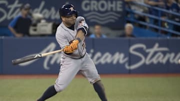 Aug 13, 2016; Toronto, Ontario, CAN; Houston Astros second baseman Jose Altuve (27) hits a triple during the eighth inning in a game against the Toronto Blue Jays at Rogers Centre. The Toronto Blue Jays won 4-2. Mandatory Credit: Nick Turchiaro-USA TODAY Sports