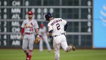 Aug 16, 2016; Houston, TX, USA; St. Louis Cardinals shortstop Greg Garcia (35) reacts as Houston Astros third baseman Alex Bregman (2) rounds the bases after hitting a home run during the first inning at Minute Maid Park. Mandatory Credit: Troy Taormina-USA TODAY Sports