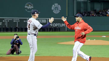 BOSTON, MA - OCTOBER 13: AJ Hinch #14 of the Houston Astros and Alex Cora #20 of the Boston Red Sox shake hands prior to Game One of the American League Championship Series at Fenway Park on October 13, 2018 in Boston, Massachusetts. (Photo by Elsa/Getty Images)