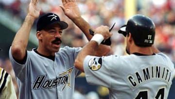 Houston Astros player Derek Bell (L) congratulates teammate Ken Caminiti after Caminiti hit a home run in the second inning of their second Division Series playoff game with the Atlanta Braves at Turner Field in Atlanta, Georgia 06 October 1999. AFP PHOTO/STEVE SCHAEFER (Photo by STEVE SCHAEFER / AFP) (Photo credit should read STEVE SCHAEFER/AFP via Getty Images)
