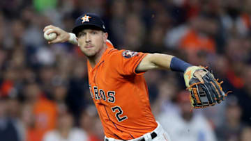 HOUSTON, TEXAS - OCTOBER 30: Alex Bregman #2 of the Houston Astros throws out Anthony Rendon (not pictured) of the Washington Nationals during the first inning in Game Seven of the 2019 World Series at Minute Maid Park on October 30, 2019 in Houston, Texas. (Photo by Elsa/Getty Images)