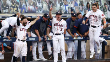 SAN DIEGO, CALIFORNIA - OCTOBER 15: Jose Altuve #27, Myles Straw #3 and Aledmys Diaz #16 of the Houston Astros reacts to a Carlos Correa #1 walk off home run to beat the Tampa Bay Rays 4-3 in Game Five of the American League Championship Series at PETCO Park on October 15, 2020 in San Diego, California. (Photo by Ezra Shaw/Getty Images)