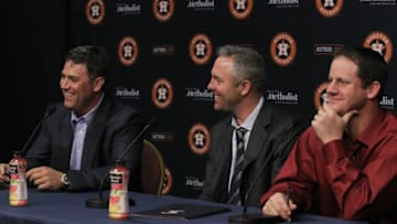 HOUSTON, TX - APRIL 05: Lance Berkman, Reid Ryan, President of Business Opeations and Roy Oswalt, from left, take questions from the media at Minute Maid Park on April 5, 2014 in Houston, Texas. Berkman and Oswalt signed one day personal services contracts to retire as Houston Astros. (Photo by Bob Levey/Getty Images)