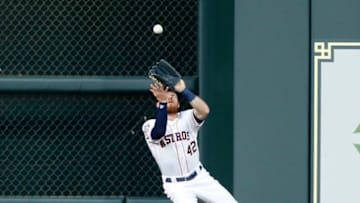 HOUSTON, TX - APRIL 15: Derek Fisher #21 of the Houston Astros catches a fly ball by Adrian Beltre #29 of the Texas Rangers in the second inning at Minute Maid Park on April 15, 2018 in Houston, Texas. All players are wearing #42 in honor of Jackie Robinson Day. (Photo by Bob Levey/Getty Images)