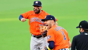 Oct 16, 2020; San Diego, California, USA; Houston Astros shortstop Carlos Correa (1) and second baseman Jose Altuve (back) celebrate after making a double play against the Tampa Bay Rays to end the sixth inning during game six of the 2020 ALCS at Petco Park. Mandatory Credit: Jayne Kamin-Oncea-USA TODAY Sports