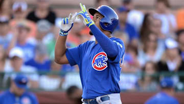 Mar 24, 2016; Scottsdale, AZ, USA; Chicago Cubs third baseman Jeimer Candelario (75) points skyward after hitting a home run against the San Francisco Giants during the fourth inning at Scottsdale Stadium. Mandatory Credit: Joe Camporeale-USA TODAY Sports