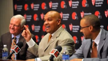 Jan 13, 2016; Berea, OH, USA; Cleveland Browns owner Jimmy Haslam (left) and new head coach Hue Jackson talk during a press conference at the Cleveland Browns training facility. Mandatory Credit: Ken Blaze-USA TODAY Sports