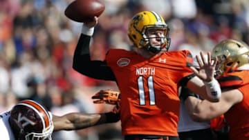 Jan 30, 2016; Mobile, AL, USA; North squad quarterback Carson Wentz of North Dakota State (11) throws while under pressure from South squad defensive end Dadi Nicolas of Virginia Tech during first half of the Senior Bowl at Ladd-Peebles Stadium. Mandatory Credit: Butch Dill-USA TODAY Sports