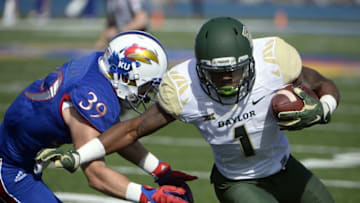 Oct 10, 2015; Lawrence, KS, USA; Baylor Bears wide receiver Corey Coleman (1) scores a touchdown against Kansas Jayhawks safety Michael Glatczak (39) in the first half at Memorial Stadium. Mandatory Credit: John Rieger-USA TODAY Sports