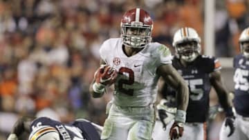 Nov 28, 2015; Auburn, AL, USA; Alabama Crimson Tide running back Derrick Henry (2) races past Auburn Tigers defenders and scores a touchdown in the fourth quarter to beat the Auburn Tigers 29-13 Jordan Hare Stadium. Mandatory Credit: John Reed-USA TODAY Sports