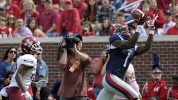 Oct 10, 2015; Oxford, MS, USA; Mississippi Rebels wide receiver Laquon Treadwell (1) catches a pass against New Mexico State Aggies defensive back Jaden Wright (21) during the game at Vaught-Hemingway Stadium. Mandatory Credit: Justin Ford-USA TODAY Sports