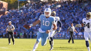 Nov 5, 2016; Chapel Hill, NC, USA; North Carolina Tar Heels quarterback Mitch Trubisky (10) scores a touchdown on his forth quarter run against the Georgia Tech Yellow Jackets at Kenan Memorial Stadium. The North Carolina Tar Heels defeated the Georgia Tech Yellow Jackets 48-20. Mandatory Credit: James Guillory-USA TODAY Sports