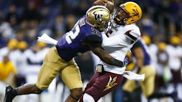 Nov 19, 2016; Seattle, WA, USA; Washington Huskies defensive back Budda Baker (32) sacks Arizona State Sun Devils quarterback Manny Wilkins (5) during the first quarter at Husky Stadium. Mandatory Credit: Jennifer Buchanan-USA TODAY Sports