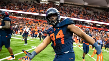 SYRACUSE, NY - OCTOBER 27: Alton Robinson #94 of the Syracuse Orange celebrates on the field after the team's win over North Carolina State Wolfpack at the Carrier Dome on October 27, 2018 in Syracuse, New York. Syracuse upsets North Carolina State 51-41. (Photo by Brett Carlsen/Getty Images)