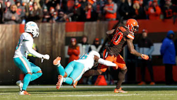CLEVELAND, OH - NOVEMBER 24: Adrian Colbert #36 of the Miami Dolphins tackles Jarvis Landry #80 of the Cleveland Browns during the second quarter at FirstEnergy Stadium on November 24, 2019 in Cleveland, Ohio. (Photo by Kirk Irwin/Getty Images)