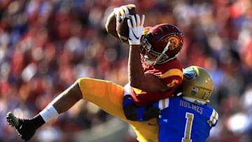 LOS ANGELES, CALIFORNIA - NOVEMBER 23: Darnay Holmes #1 of the UCLA Bruins defends as Michael Pittman Jr. #6 of the USC Trojans makes a catch during the first half of a game at Los Angeles Memorial Coliseum on November 23, 2019 in Los Angeles, California. (Photo by Sean M. Haffey/Getty Images)