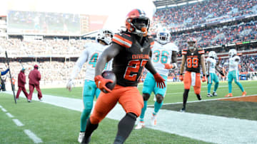 CLEVELAND, OHIO - NOVEMBER 24: Running back Kareem Hunt #27 of the Cleveland Browns runs to score a touchdown while under pressure from defensive back Nik Needham #40 of the Miami Dolphins during the first half at FirstEnergy Stadium on November 24, 2019 in Cleveland, Ohio. (Photo by Jason Miller/Getty Images)"n