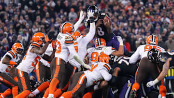 BALTIMORE, MARYLAND - DECEMBER 30: Quarterback Lamar Jackson #8 of the Baltimore Ravens fumbles the ball as he attempts a touchdown in the second quarter at M&T Bank Stadium on December 30, 2018 in Baltimore, Maryland. (Photo by Patrick Smith/Getty Images)