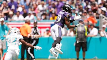 MIAMI, FLORIDA - SEPTEMBER 08: Earl Thomas #29 of the Baltimore Ravens intercepts a pass intended for Kenyan Drake #32 of the Miami Dolphins during the first quarter at Hard Rock Stadium on September 08, 2019 in Miami, Florida. (Photo by Michael Reaves/Getty Images)