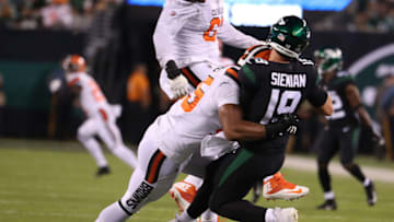 EAST RUTHERFORD, NEW JERSEY - SEPTEMBER 16: Trevor Siemian #19 of the New York Jets is hurt on this play after he is tackled after a pass by Myles Garrett #95 of the Cleveland Browns during their game at MetLife Stadium on September 16, 2019 in East Rutherford, New Jersey. (Photo by Al Bello/Getty Images)