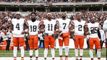 CINCINNATI, OH - DECEMBER 11: Deshaun Watson #4, David Bell #18, Donovan Peoples-Jones #11, Jacoby Brissett #7, Amari Cooper #2, and Demetric Felton Jr. #25 of the Cleveland Browns stand on the sidelines during the national anthem prior to an NFL football game against the Cincinnati Bengals at Paycor Stadium on December 11, 2022 in Cincinnati, Ohio. (Photo by Kevin Sabitus/Getty Images)