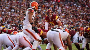 LANDOVER, MD - JANUARY 01: Carson Wentz #11 of the Washington Commanders looks over the defense before a play against the Cleveland Browns during the first half of the game at FedExField on January 1, 2023 in Landover, Maryland. (Photo by Scott Taetsch/Getty Images)