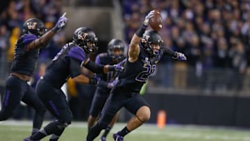 SEATTLE, WA - NOVEMBER 12: Defensive back Taylor Rapp #21 of the Washington Huskies reacts after making an interception against the USC Trojans on November 12, 2016 at Husky Stadium in Seattle, Washington. The Trojans defeated the Huskies 24-13. (Photo by Otto Greule Jr/Getty Images)