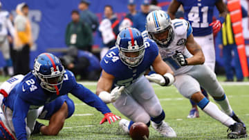 EAST RUTHERFORD, NJ - DECEMBER 18: Olivier Vernon #54 of the New York Giants recovers a fumble by Zach Zenner #34 of the Detroit Lions during their game at MetLife Stadium on December 18, 2016 in East Rutherford, New Jersey. (Photo by Al Bello/Getty Images)