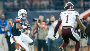 AUBURN, AL - SEPTEMBER 30: Wide receiver Ryan Davis #23 of the Auburn Tigers looks to maneuver by defensive back Brandon Bryant #1 of the Mississippi State Bulldogs at Jordan-Hare Stadium on September 30, 2017 in Auburn, Alabama. (Photo by Michael Chang/Getty Images)
