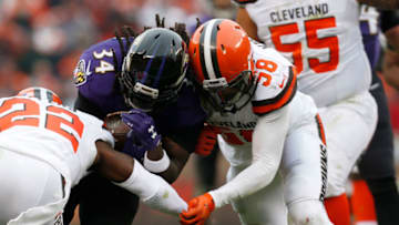 CLEVELAND, OH - DECEMBER 17: Alex Collins #34 of the Baltimore Ravens collides with Christian Kirksey #58 of the Cleveland Browns in the first half at FirstEnergy Stadium on December 17, 2017 in Cleveland, Ohio. (Photo by Kirk Irwin/Getty Images)