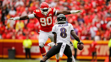 KANSAS CITY, MO - SEPTEMBER 22: Emmanuel Ogbah #90 of the Kansas City Chiefs blocks the view of Lamar Jackson #8 of the Baltimore Ravens in the third quarter at Arrowhead Stadium on September 22, 2019 in Kansas City, Missouri. (Photo by David Eulitt/Getty Images)