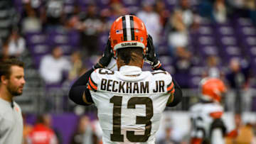 MINNEAPOLIS, MN - OCTOBER 03: Odell Beckham Jr. #13 of the Cleveland Browns puts on his helmet before the game against the Minnesota Vikings at U.S. Bank Stadium on October 3, 2021 in Minneapolis, Minnesota. (Photo by Stephen Maturen/Getty Images)