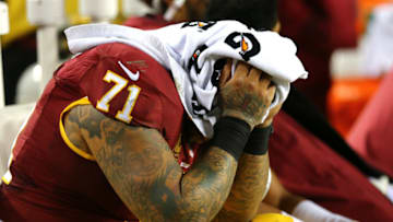 LANDOVER, MD - JANUARY 10: Tackle Trent Williams #71 of the Washington Redskins covers his face with a towel against the Green Bay Packers in the fourth quarter during the NFC Wild Card Playoff game at FedExField on January 10, 2016 in Landover, Maryland. (Photo by Elsa/Getty Images)