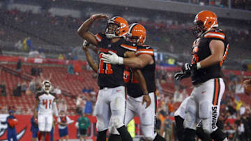 TAMPA, FL - AUGUST 26: Wide receiver Jordan Leslie #11 of the Cleveland Browns gets a hug from center Anthony Fabiano #61as he salutes the crowd while celebrating his touchdown during the fourth quarter of an NFL preseason football game against the Tampa Bay Buccaneers on August 26, 2017 at Raymond James Stadium in Tampa, Florida. (Photo by Brian Blanco/Getty Images)