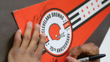 Cleveland Browns free safety John Johnson (43) signs autographs for fans after an NFL football game against the Cincinnati Bengals, Sunday, Jan. 9, 2022, in Cleveland, Ohio. [Jeff Lange/Beacon Journal]Browns 24