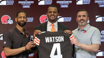 Cleveland Browns quarterback Deshaun Watson, center, poses for a portrait with general manager Andrew Berry, left, and head coach Kevin Stefanski during Watson's introductory press conference at the Cleveland Browns Training Facility on Friday.Watsonpress 11