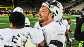 Nov 10, 2018; Iowa City, IA, USA; Northwestern Wildcats offensive lineman Blake Hance (72) and linebacker Nate Hall (32) celebrate after their victory over the Iowa Hawkeyes at Kinnick Stadium. Mandatory Credit: Jeffrey Becker-USA TODAY Sports