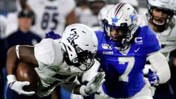 Rice running back Aston Walter (1) runs the ball as MTSU safety Jovante Moffatt (7) moves in for tackle during the game on Saturday, Nov. 16, 2019, at MTSU.18 Mtsu V Rice